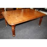A William IV mahogany extending dining table, the rectangular top and three inset leaves with