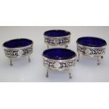 A set of four early 19th century silver salts, each with beaded rim, pierced scrolled body with