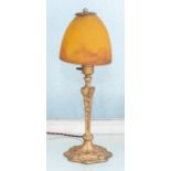 An early to mid 20th century art deco style table lamp, gilt metal with an orange shade, 45cm high