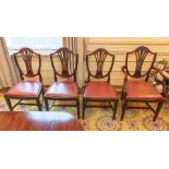 A set of eight mahogany Sheraton style dining room chairs including two carvers, pierced splats with