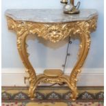 A pair of mid 20th century French marble topped and gilt wood wall mounted console tables, in