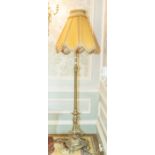 A early 20th century Georgian style brass floor light with fluted column, ornate foliate pierced