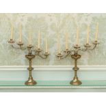 A pair of late 19th/ early 20th century five branch candlesticks with glass drops 50cm H x 46cm W (