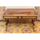 A Regency rosewood and mahogany brass inlaid library table, circa 1810, the rosewood top with