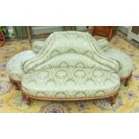 An early Victorian walnut framed and upholstered conversation seat 76cm H x 178cm W x 116cm D. Circa