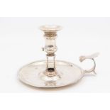 A George II silver chamberstick circular base, urn shaped scone with detachable nozzle, scroll