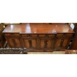 A mid 20th Century mahogany sideboard, four drawers above three cupboards, 200cm long and 50cm deep