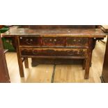 A late 19th/ early 20th Century Chinese altar table with three short and two long drawers, length