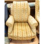 A Victorian sofa chair having turned legs on casters with gold upholstery
