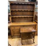 A mid 20th Century reproduction oak dresser, two drawers over 2 cupboard doors and two-shelved plate