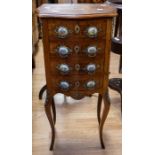 A reproduction Louis XV style small chest, having four drawers with porcelain handles and ormolu