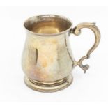 A George III silver baluster mug, scroll capped handle, spreading circular foot, makers marks RB,