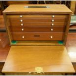 A mid 20th Century collectors' coin cabinet, with five internal drawers and lift out lid (key not