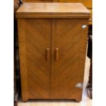 An early 20th Century sewing cabinet