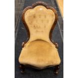 A late 19th Century ladies' parlour chair in mahogany with light brown upholstery and button back