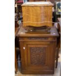 A late 19th Century oak carved floor cupboard with single carved cupboard door ,  along with a
