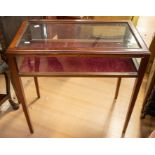 A reproduction Georgian style glass display cabinet in mahogany, having glass panel top and sides,