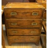 A reproduction mahogany campaign chest, four drawers, side carrier handles and corner protectors