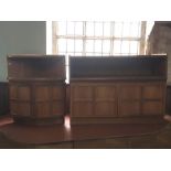 MODERN DESIGN; A teak side cupboard, top with open recess above two outward opening doors opening to