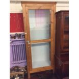 A pine decorative display cabinet, mid 20th Century, with glass shelves