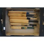 Six miniature signed cricket bats