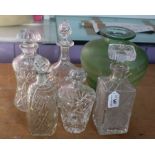 Five glass decanters and glass vase