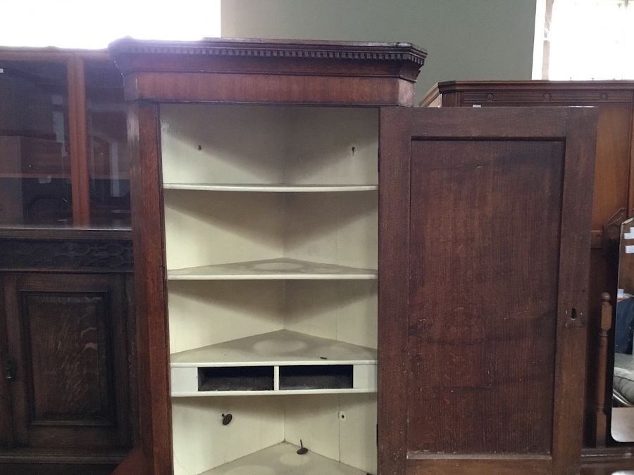 A late 18th century oak corner cabinet, dentil moulding to upper cornice, various cuts of the wood - Image 2 of 2