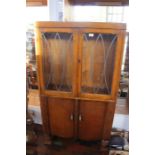 A good vintage 1930s astragal glazed two door cabinet in art deco style, with deco handles, shaped