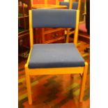 A good set of three blue fabric modern stacking chairs