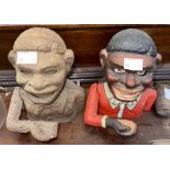 Two cast iron articulated ‘man eating money’ money boxes -  These items are listed on the basis they