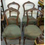 A set of four Victorian balloon back dining room chairs, upholstered seats turned front legs and