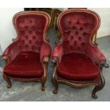A pair of victorian mahogany upholstered button back armchairs, velvet upholstery on scrolling front