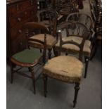 A pair of Victorian balloon back dining chairs, damaged upholstery A/F seats on front turned legs,