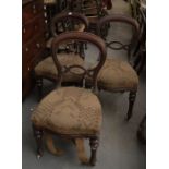 A set of six Victorian balloon back chairs, upholstered seats on turned front legs with ceramic