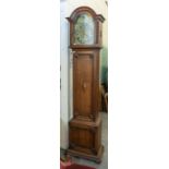 A 19th century oak cased longcase clock, metal dial with roman numerals, surmounted by gilt and