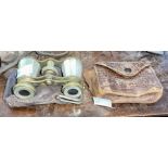 Two pairs of opera glasses one mother of pearl and brass in case and one black