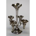 A silver five branch epergne, the quaterfoil base rising to a slender tapered column rising four