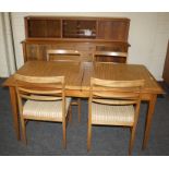 A good circa 1960/1970's figured hardwood dining suite comprising a drawleaf dining table W155cm,