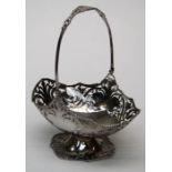 A George III style silver swing handled cake basket, London 1925, w21cm 13oz