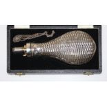 A cased silver gun powder flask of large size, Sheffield 1957, marks for John Dixon and Sons, L20cm