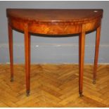 A George III mahogany card table, the demi lune foldover top over a plain frieze raised on inlaid