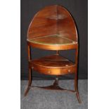 An early 19th century mahogany corner washstand, the shelved superstructure over two tiers, the