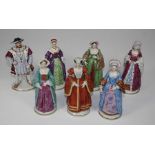 A set of seven Sitzendorf figures of King Henry VIII and his six wives. 20.5cm high, printed