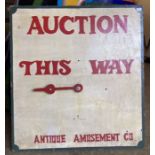 Fairground Interest: A vintage fairground 'Auction this way’ wooden board. 70 x 75 cm. along with