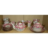 An early 19th century |Spode style part teaset decorated with roses on a white guard and parcel