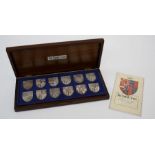 The Royal Arms, a cased set of ten silver medallions celebrating the 1977 Silver Jubilee, each