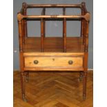 A William IV mahogany three division canterbury, with single drawer, on wrythen supports and brass