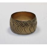 a 9ct gold hallmarked decorative band ring (1971), size R, approx. weight 9g