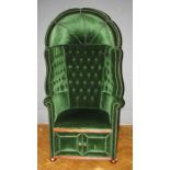 A 20th century deep green button velour and close studded upholstered 'Porters' chair with