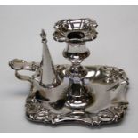 A late George IV silver chamberstick and snuffer, the near square base with embossed anthemion